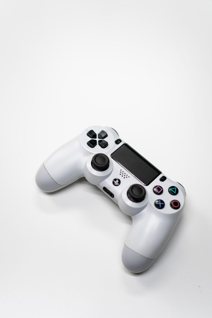 A white Sony Playstation 5 controller in a white background