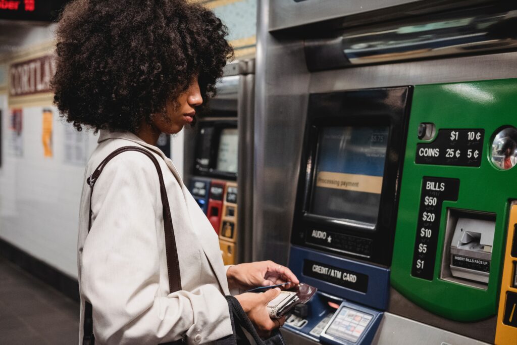 A woman who withdraw money from a bank's ATM