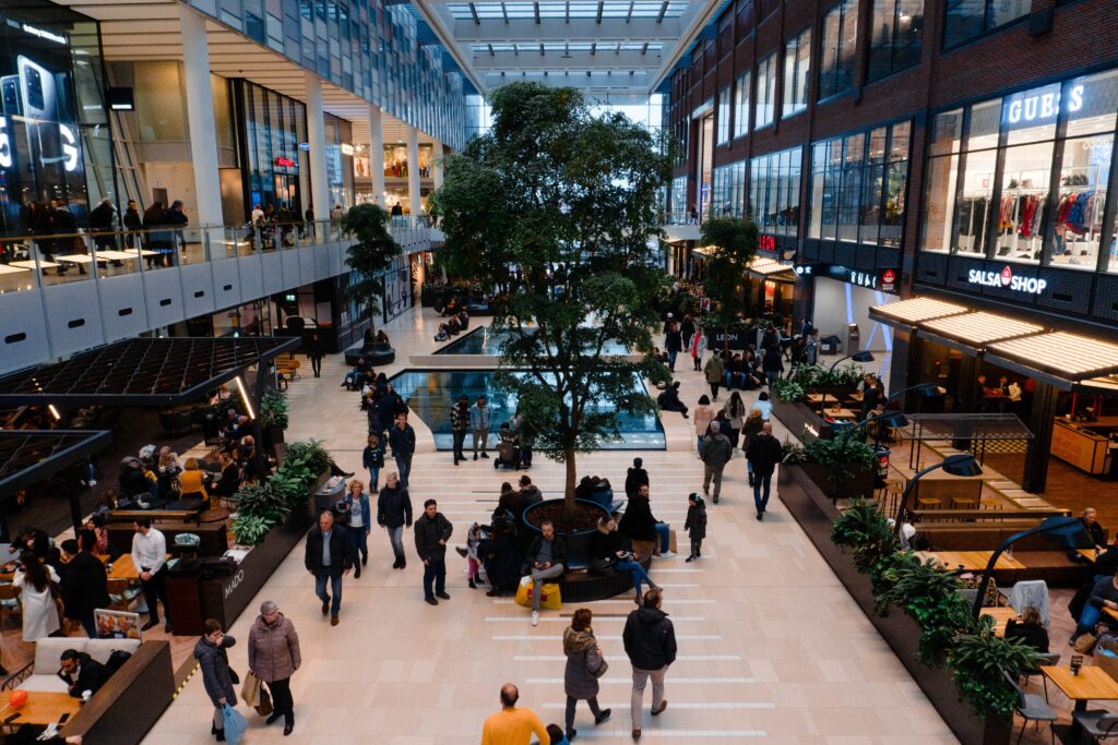 A shopping mall with visitors and have a huge walking side